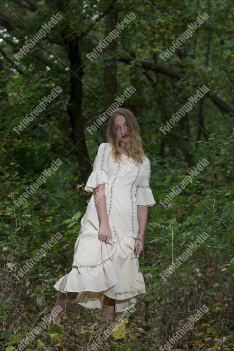 Young woman posing in a vintage dress outdoor