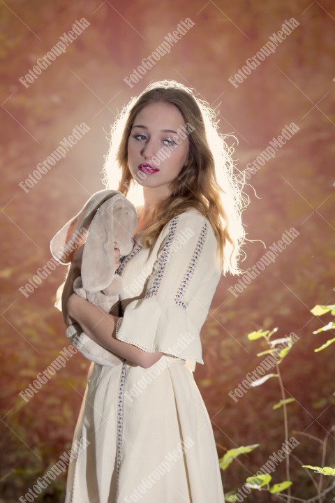 Fantasy Fairy Tale Forest, young woman posing with her soft toy