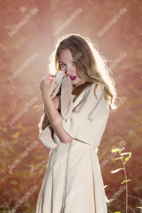 Fantasy Fairy Tale Forest, young woman posing with her soft toy