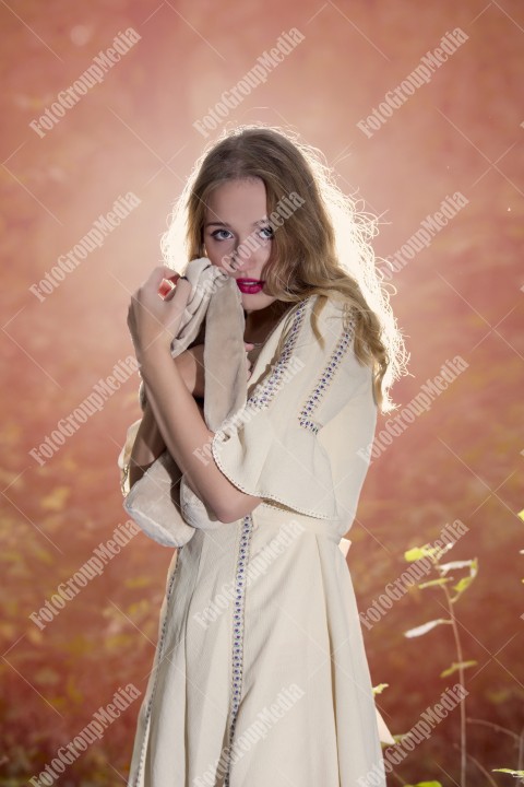 Fantasy Fairy Tale Forest, young woman posing with her soft toy