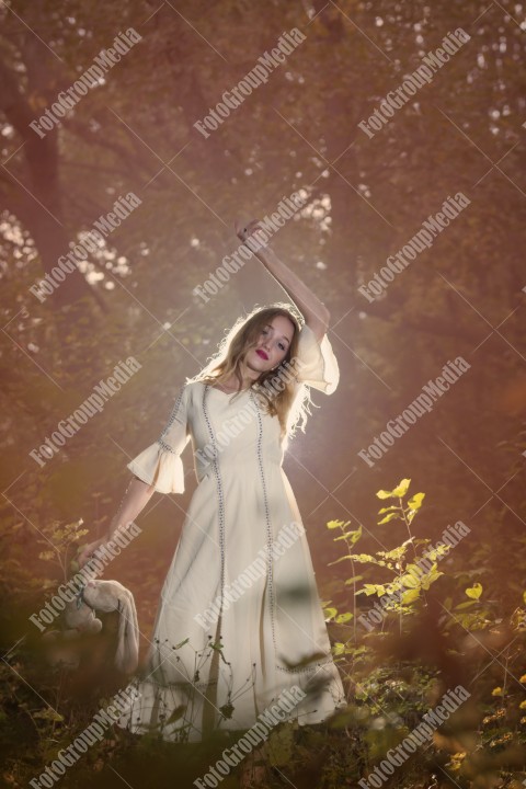 Fantasy Fairy Tale Forest, young woman posing with her soft toy