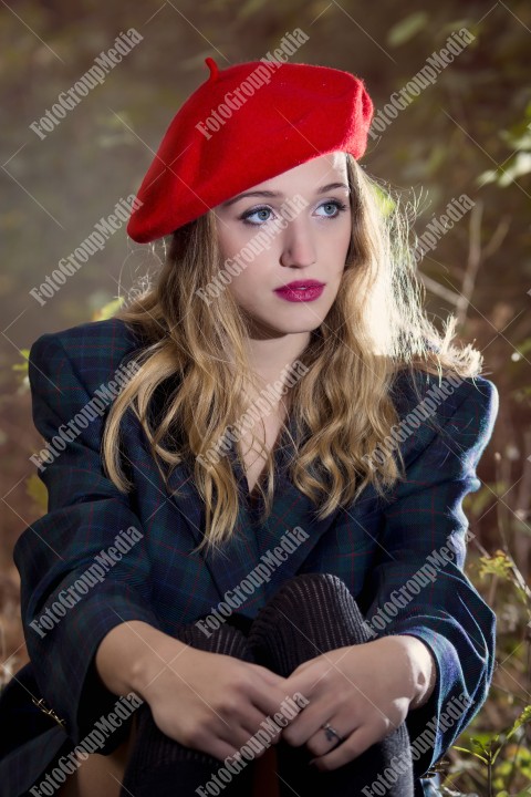 Close up portrait of a young woman with red berette