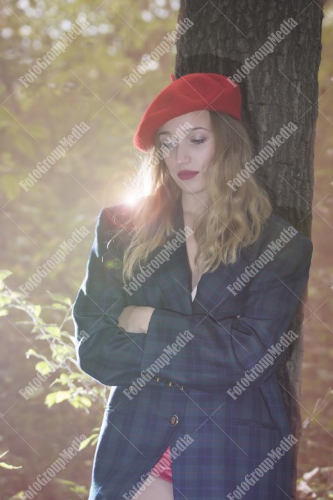 Romantic portrait of a girl in the park, autumn decor