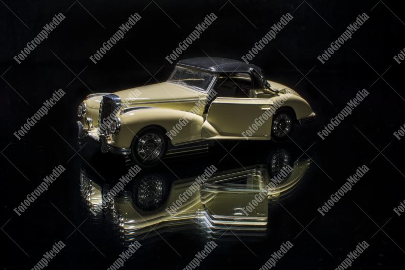 Isolated toy car on black background
