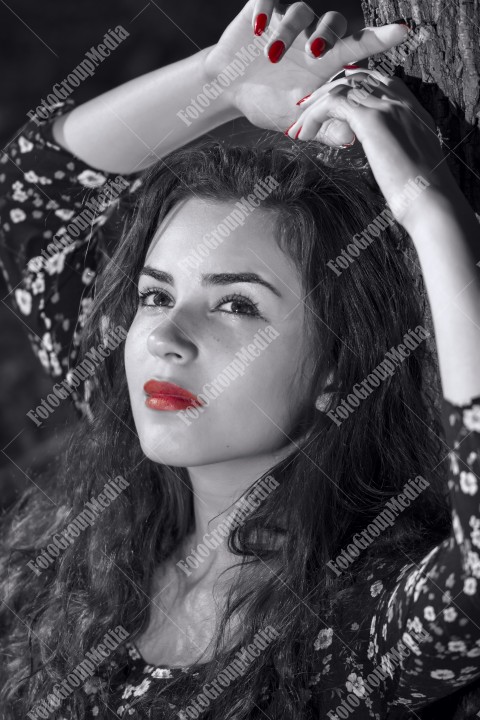 Outdoor portrait using tree as background