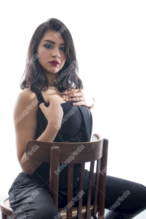 Studio shoot, brunette young woman dressed in black