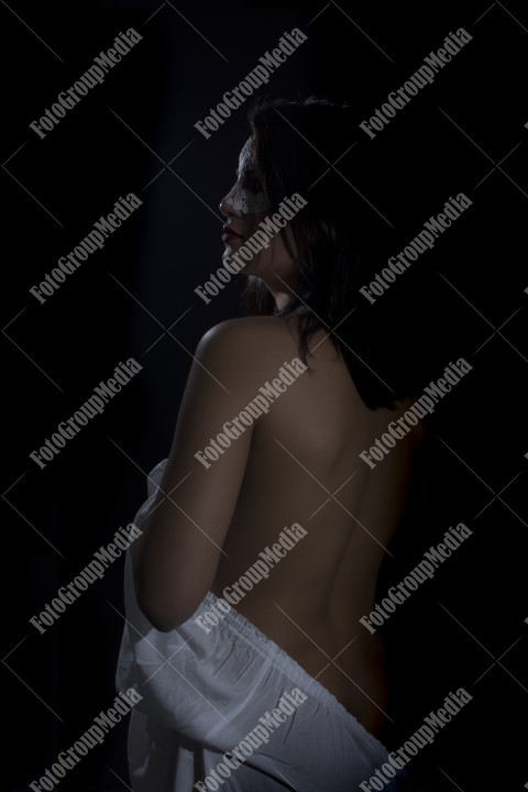 Sensual woman posing for camera, studio shoot