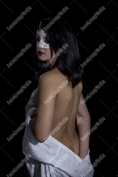 Sensual woman with naked back posing for camera