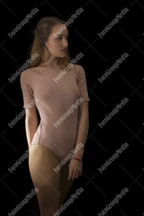 Young woman in light casual sexy clothes on black background