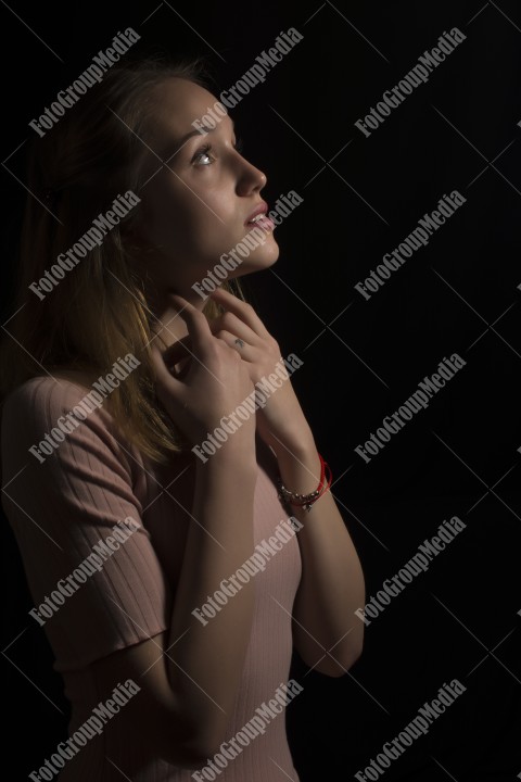 Portrait of a beautiful young woman on black bacground