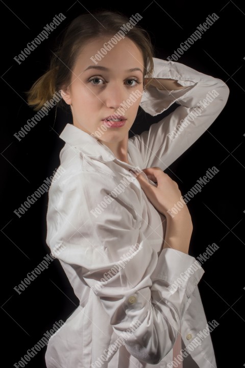 Young girl with white shirt on black background