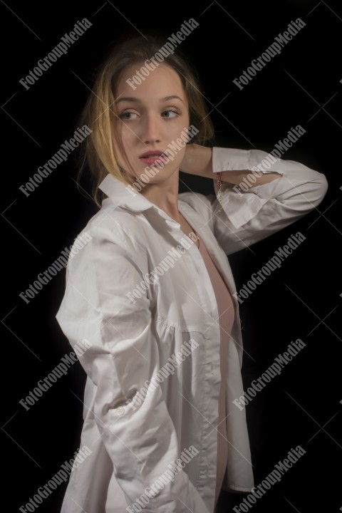 Romantic girl in white shirt on black background