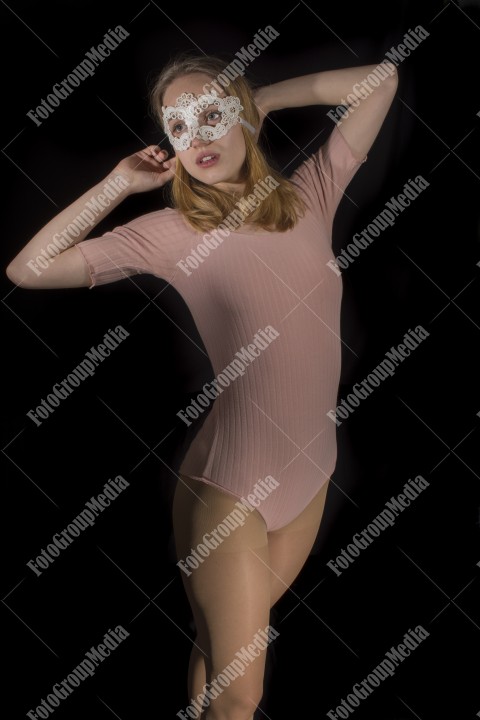 Beautiful blonde in pink bodysuit and lace mask