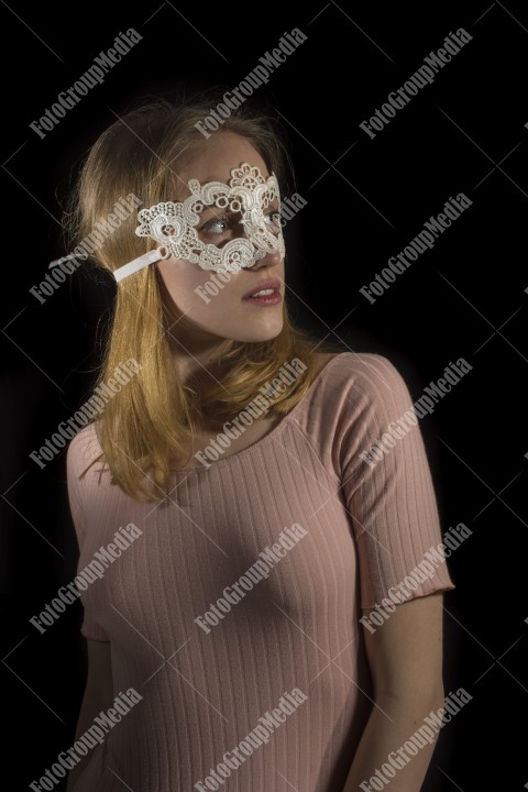 Woman with lace mask posing for camera