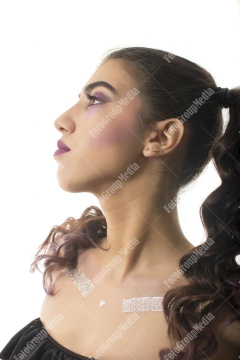 A striking portrait of a young woman with dramatic makeup