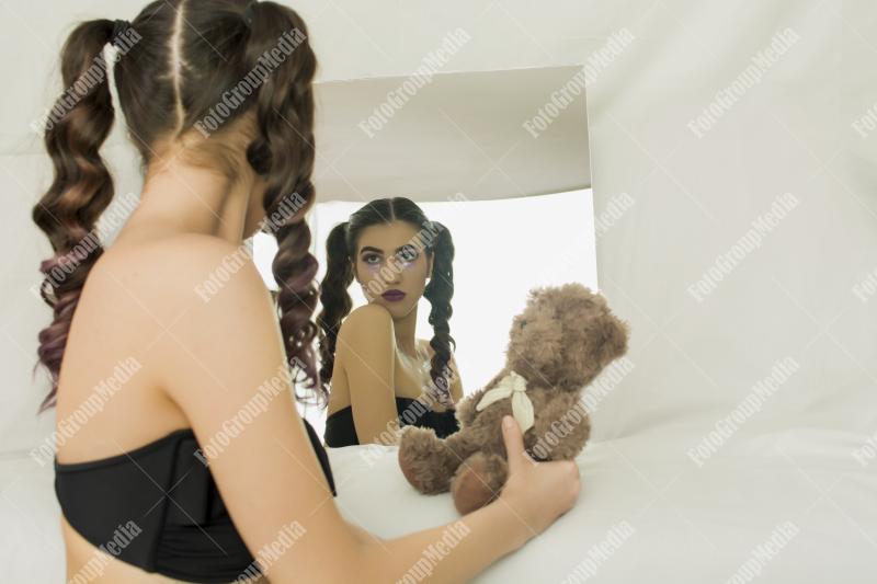 Innocence meets self-reflection in the mirror