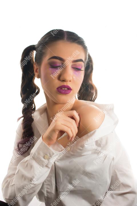 Young woman with artistic make up on white background