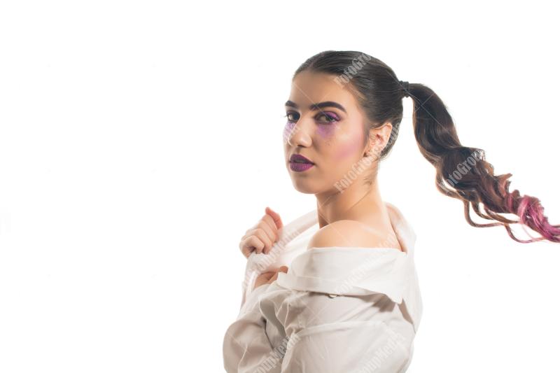 A whimsical portrait of a young woman with playful pigtails