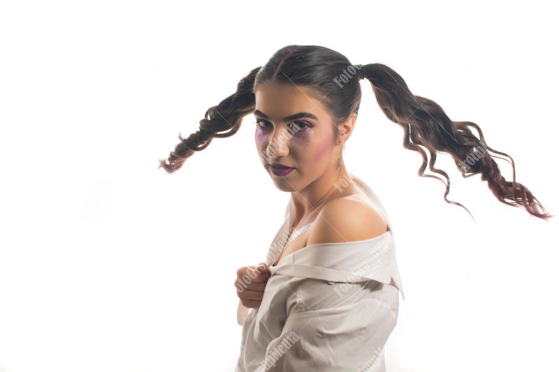 A whimsical portrait of a young woman with playful pigtails