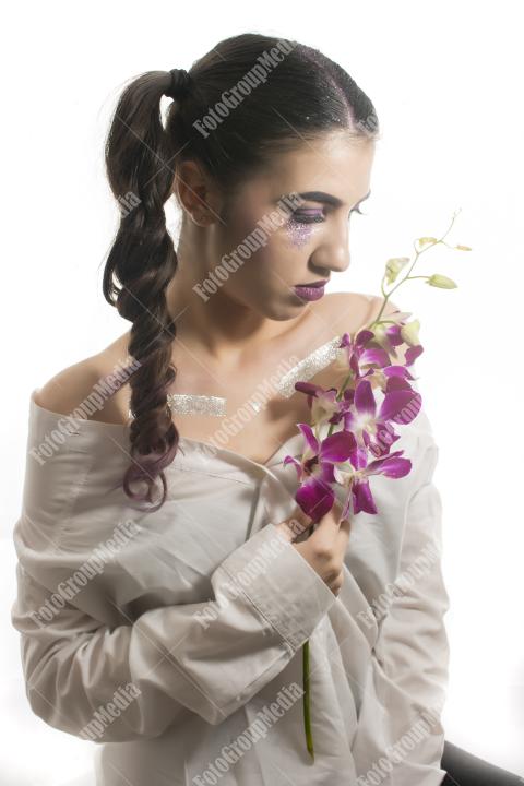 Young girl with orchid flower
