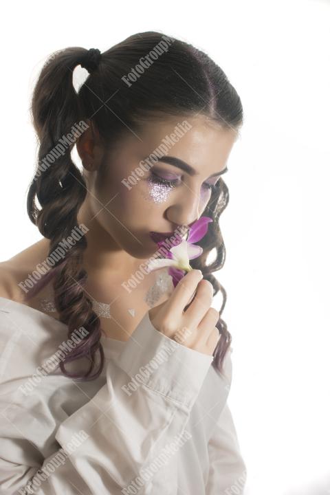 Young girl with orchid flower