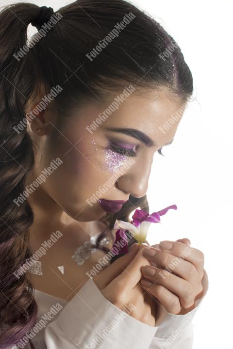 Young girl with orchid flower