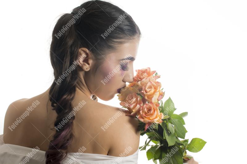 Young woman with yellow roses