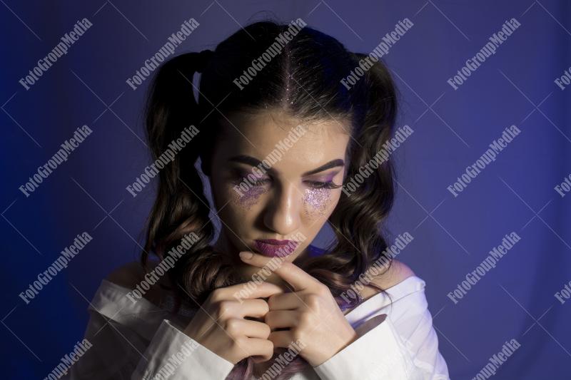 A deep-in-thought portrait of a young woman