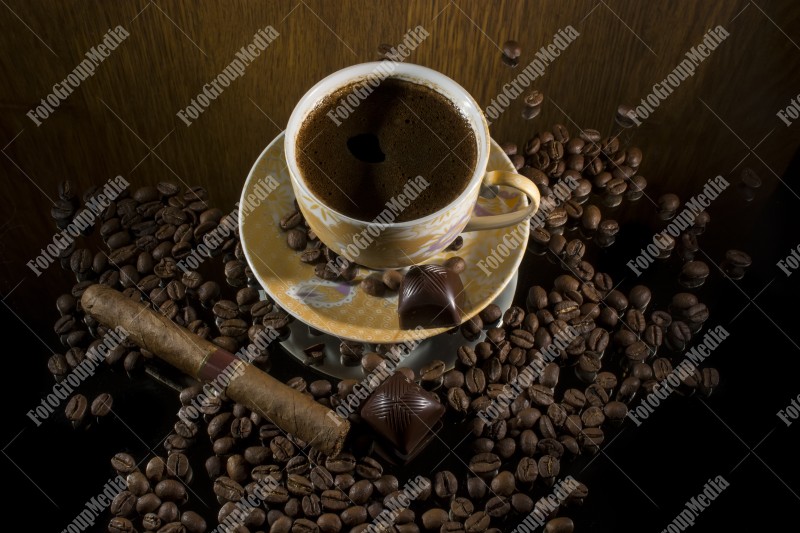 Coffee beans , cigar and hot coffee