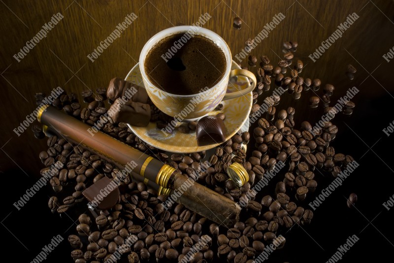 Coffee beans , cigar and hot coffee