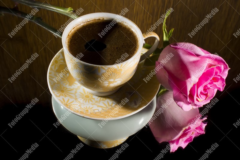 Pink rose and hot coffee