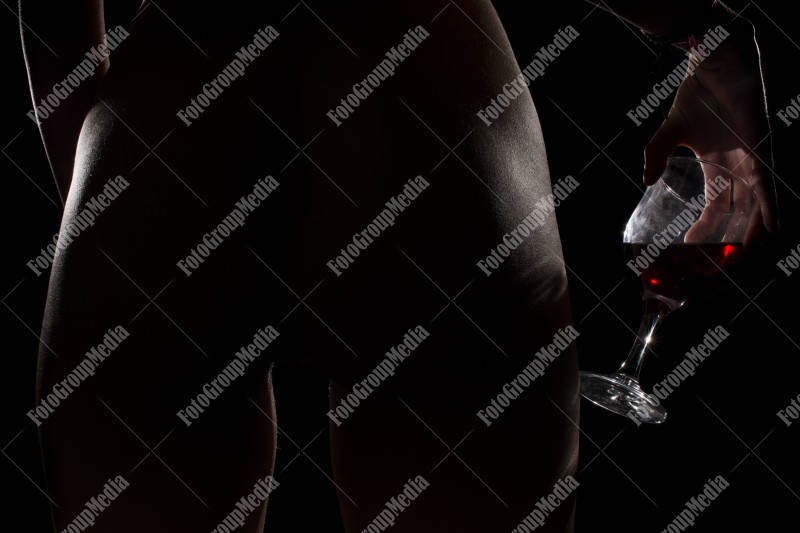 Nude woman and red wine