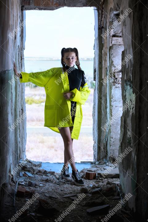 Neon jacket and gym perfect outfit for a derelic building