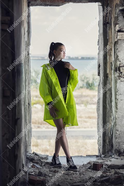 Neon jacket and gym perfect outfit for a derelic building
