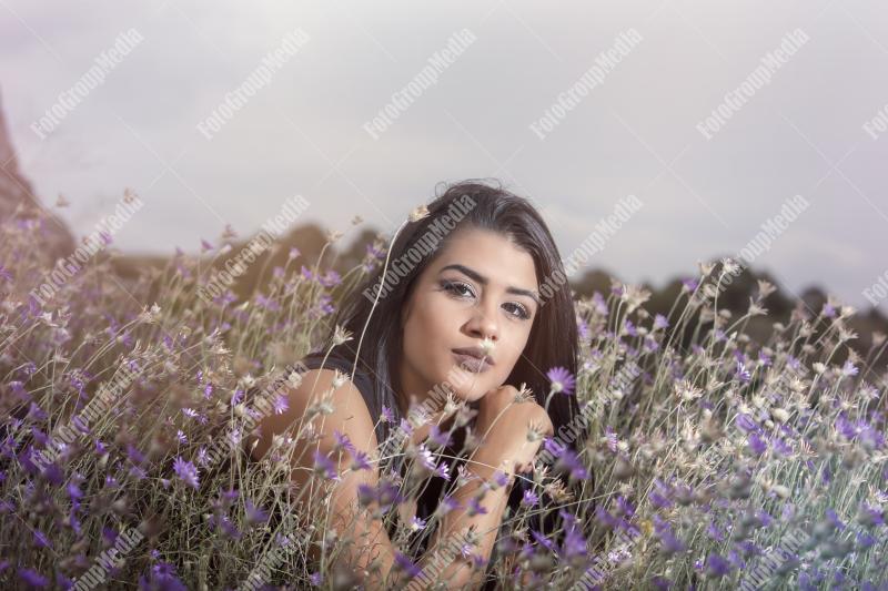 Vibrant wildflowers and beautiful young woman