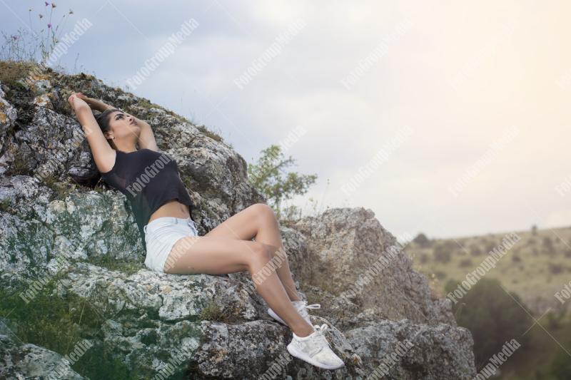 Young girl wearing summer outfit posing outdoor