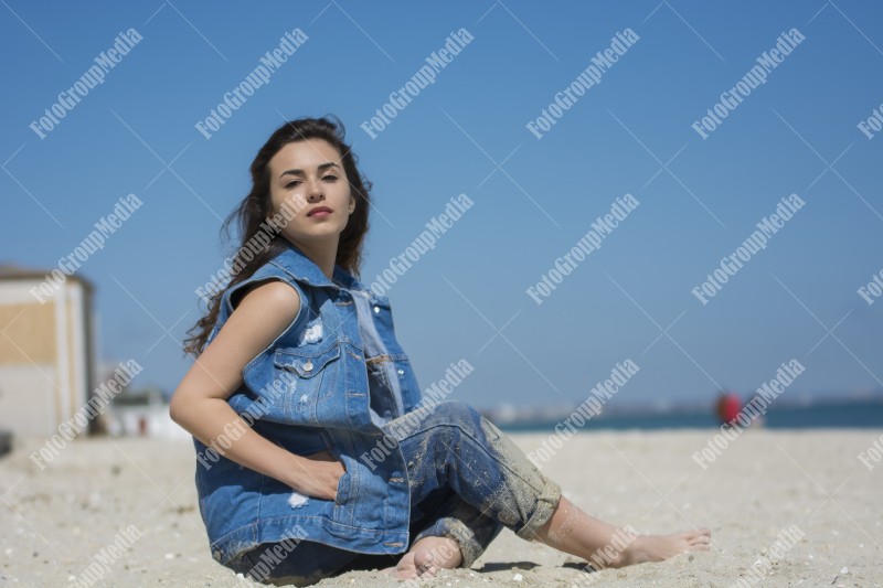 Happy woman enjoying a summer day at the beach