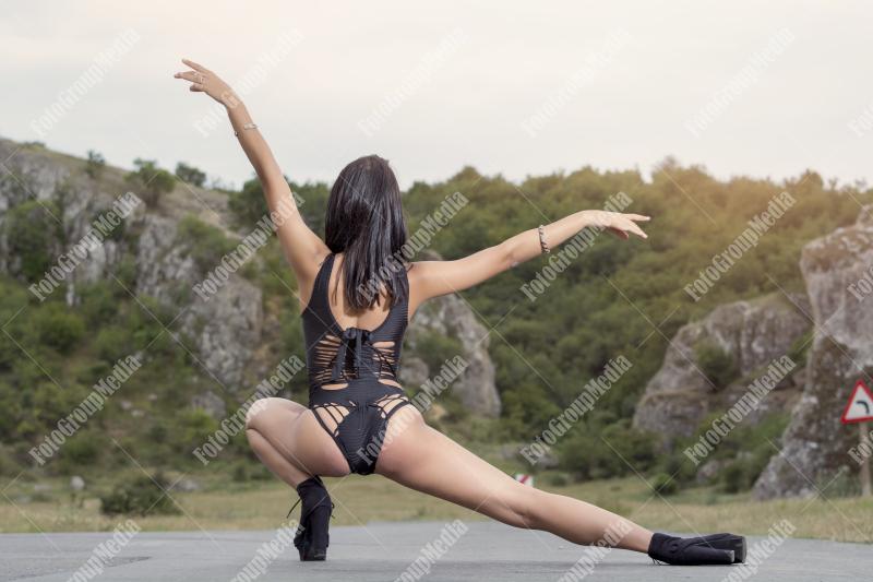 Split pose on a country road