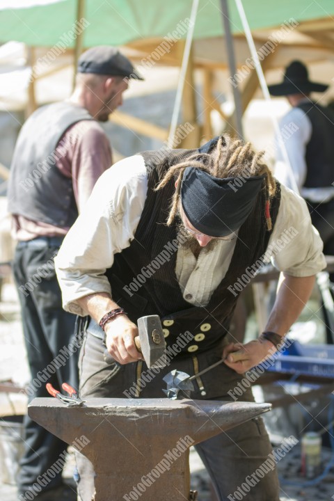 Journeymen working in courtyard of The Lutheran Cathedral of Saint Mary from Sibiu, Transylvania