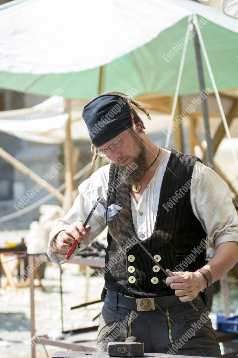 Journeymen working in courtyard of The Lutheran Cathedral of Saint Mary from Sibiu, Transylvania