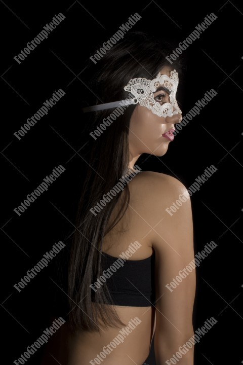 Woman with lace mask posing for camera