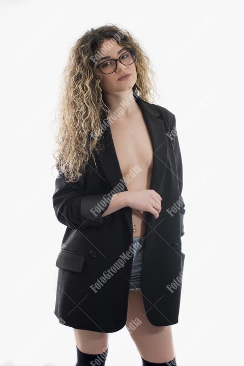 Portrait of young model with wavy hair posing on white background.Studio shot