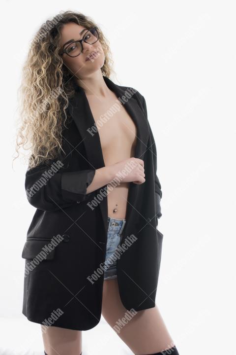 Portrait of young model with wavy hair posing on white background.Studio shot