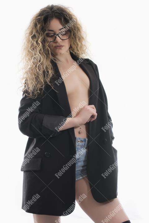 Portrait of young model with wavy hair posing on white background.Studio shot