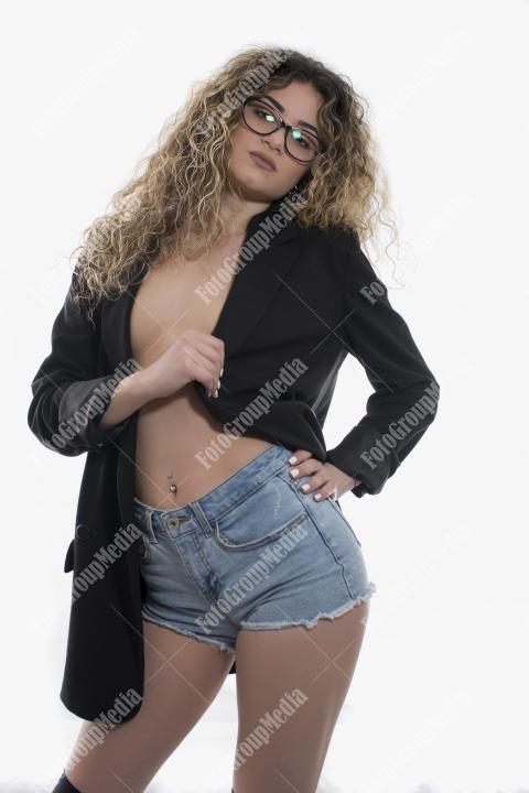 Brave and confident woman posing in studio.