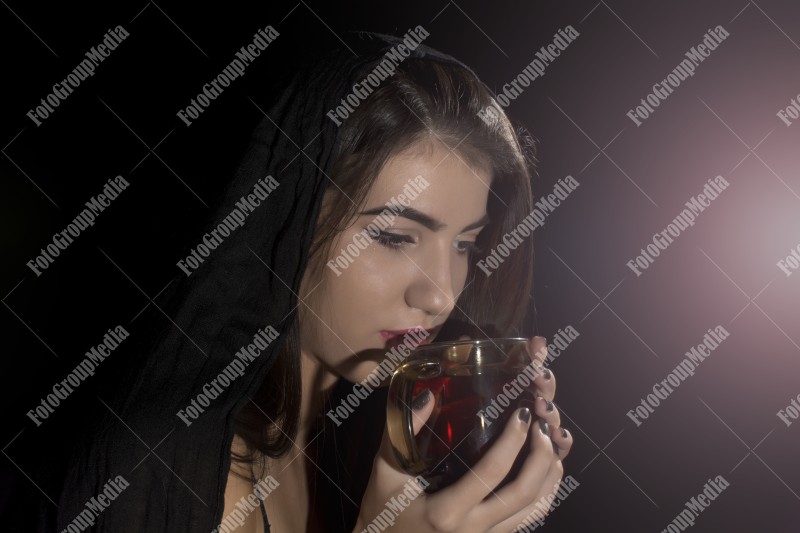 Girl drinking tea, studio shoot
