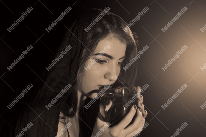 Girl drinking tea, studio shoot