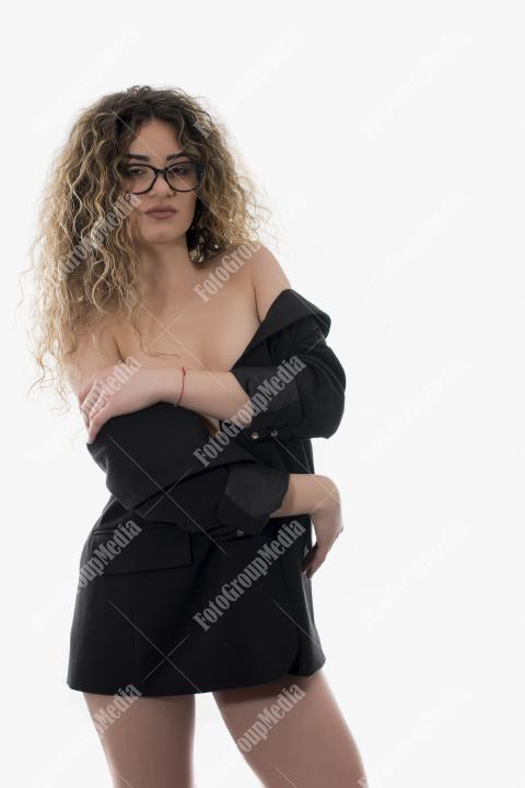 Brave and confident woman posing in studio.