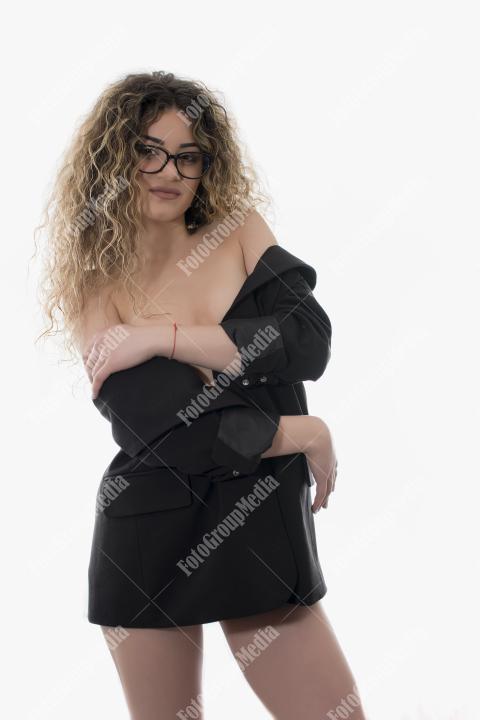 Brave and confident woman posing in studio.