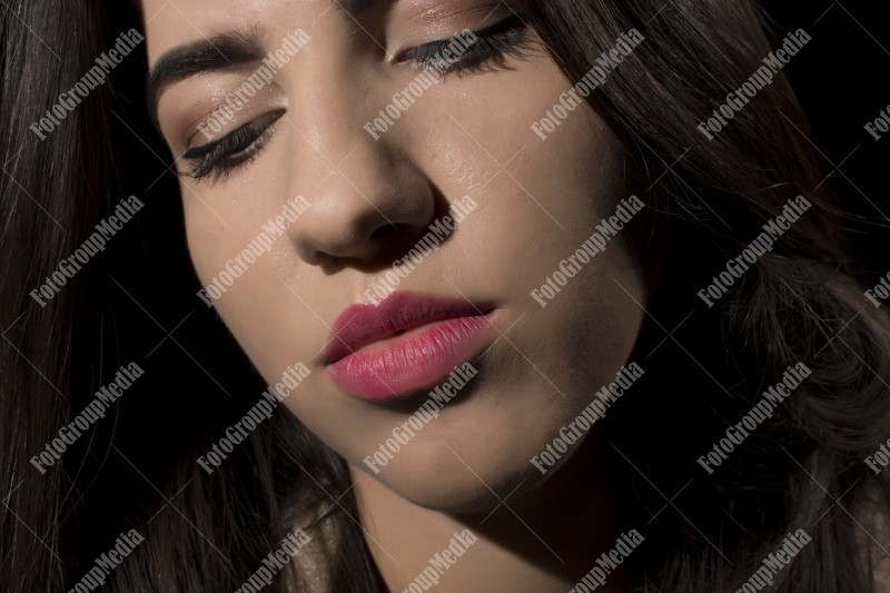 Close-up portrait of a young brunette woman